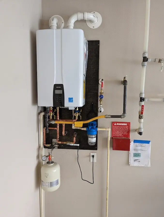 Professional plumber installing copper piping in a Punta Gorda home